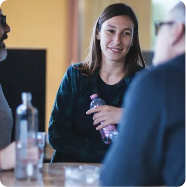 Beefree employee smiling while talking to her colleagues